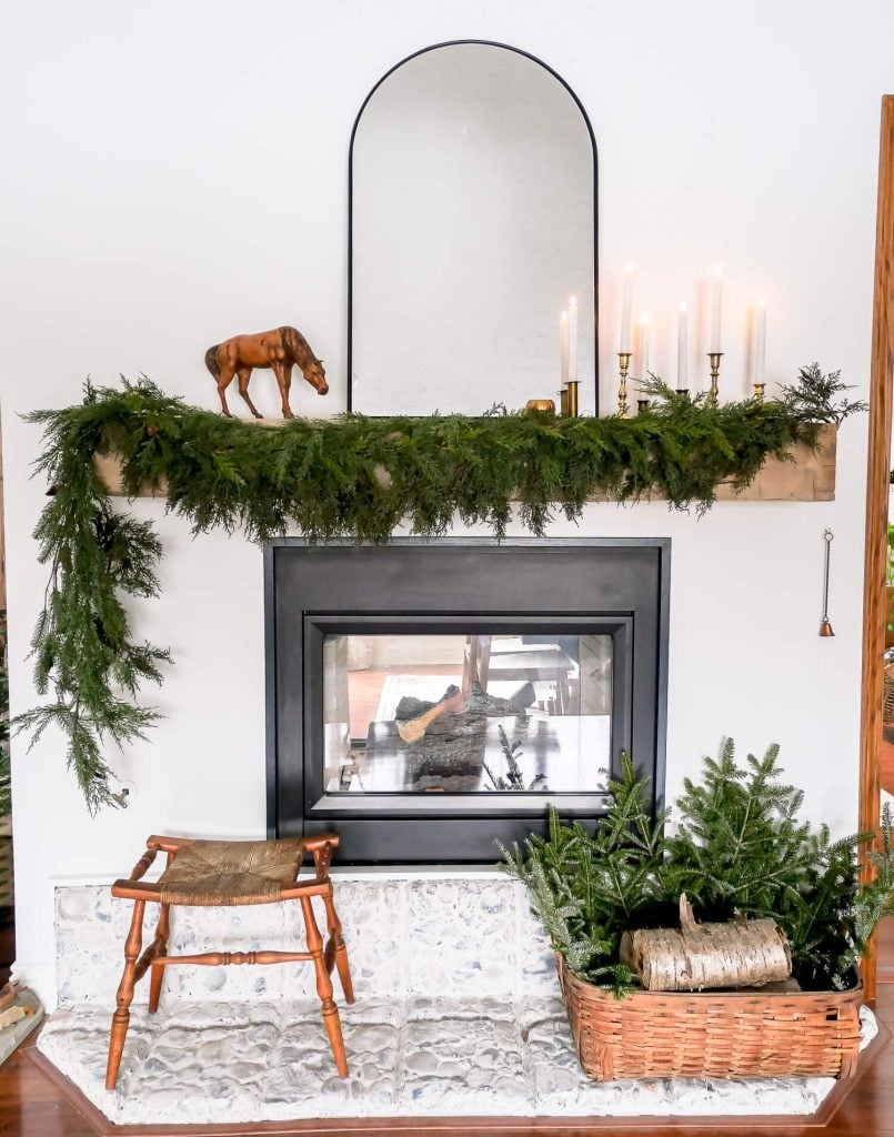 Long pine garland on a mantel.