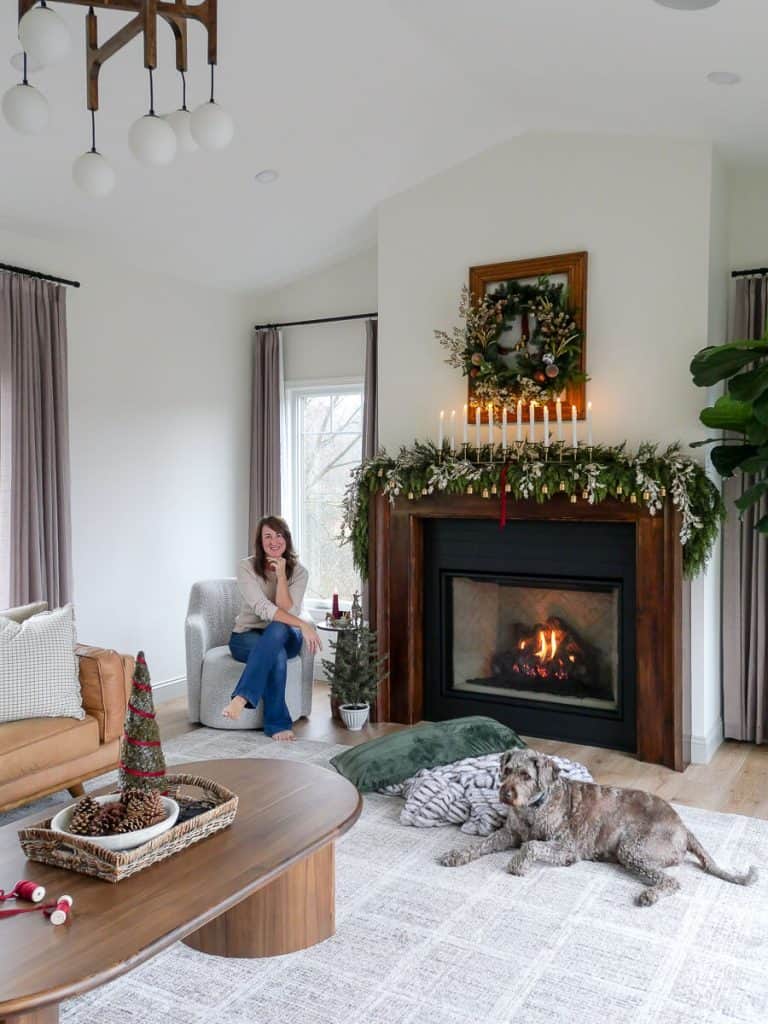 Gas fireplace with mantel decorated for Christmas.