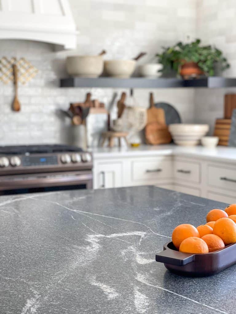 Grey granite in a white kitchen.