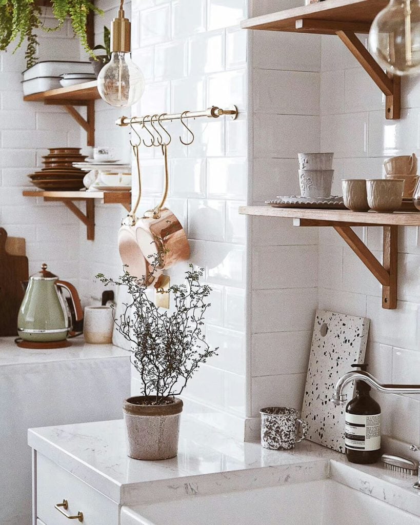 Marble countertops in a white kitchen.