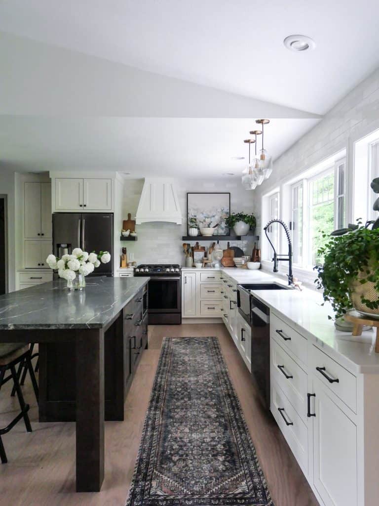 White kitchen with dark island.