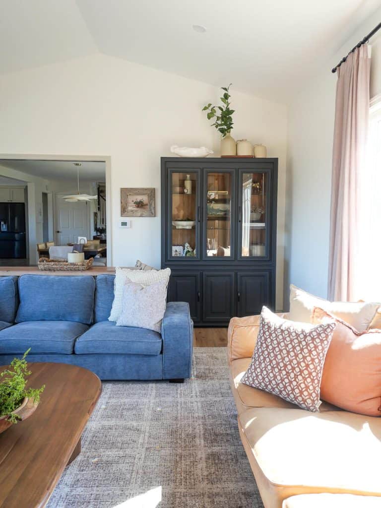 Sofa floating in the middle of a living room.