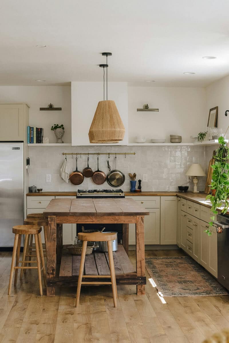 Wood countertops in a white kitchen.