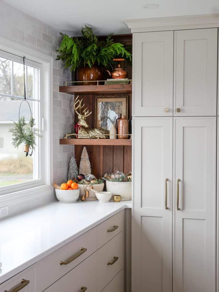 Greige kitchen cabinet color in a pantry.