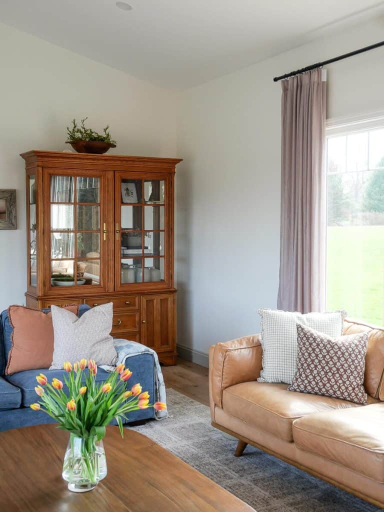 Real tulips in a vase on the coffee table.