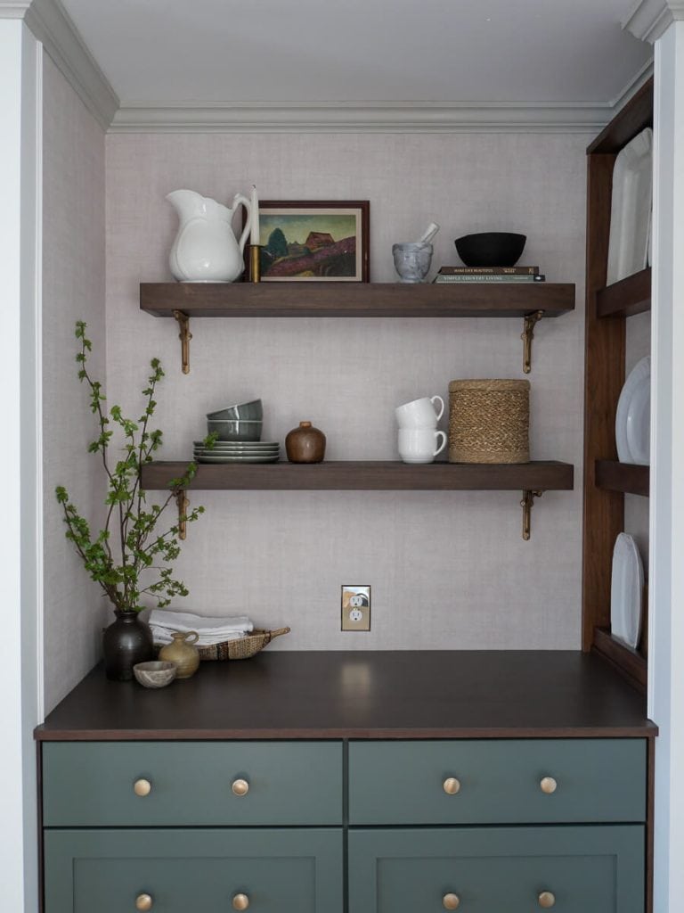 Floating shelves over a coffee bar.