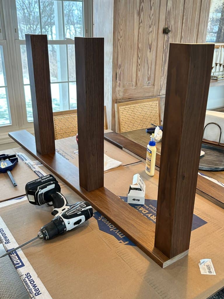 Space shelves on DIY plate rack wall shelf.