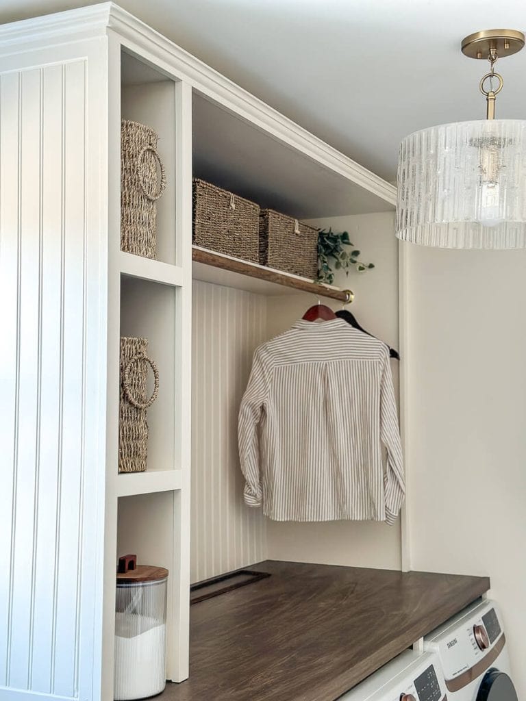 Hanging rod for a laundry room hutch.