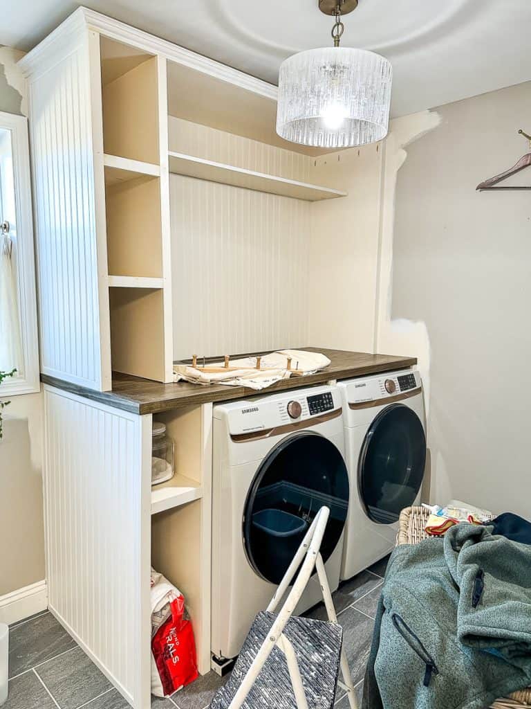 Adding face frame to DIY laundry room cabinet.