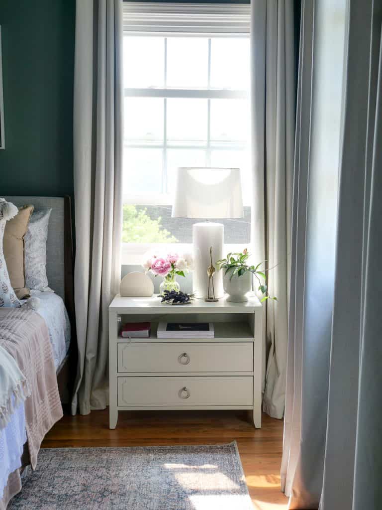 nightstand decor with a lamp and potted plants