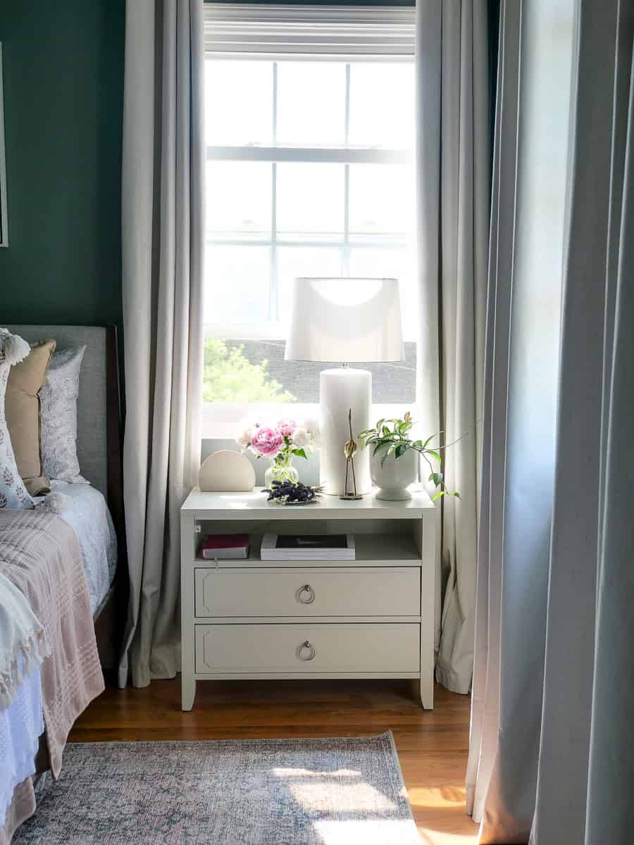 nightstand decor with a lamp and potted plants