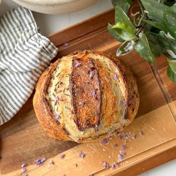 Loaf of sourdough bread on a cutting board.
