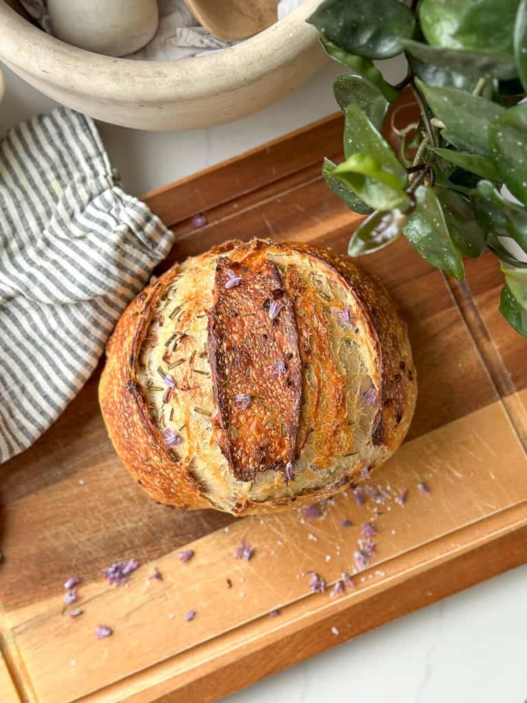 Loaf of sourdough bread on a cutting board.