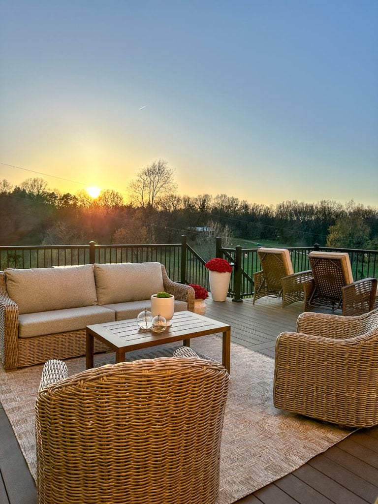 Deck with a sunrise in the background.