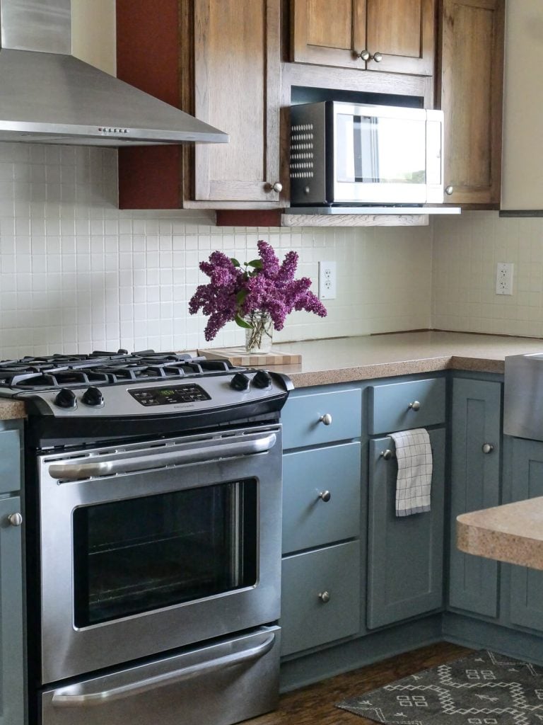Blue painted kitchen cabinets as after photo.
