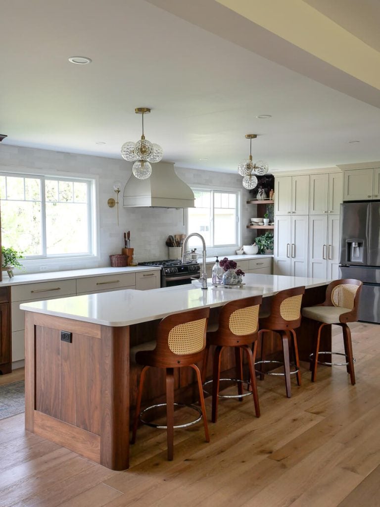 Two tone kitchen cabinets with walnut and cream cabinetry.