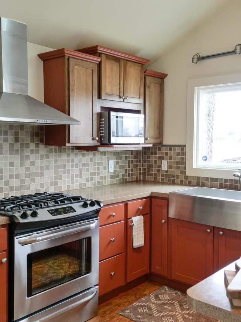 Red kitchen cabinets show a before photo.