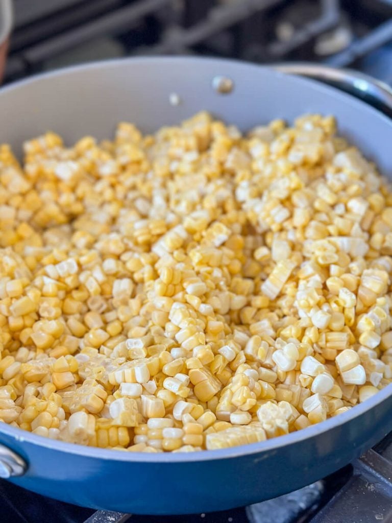 Corn cut off the cob in a frying pan.