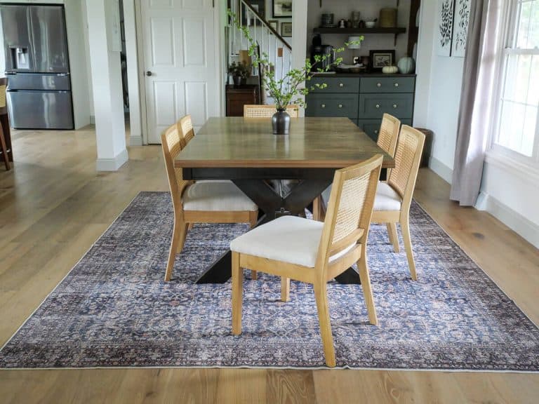 Dining room with large area rug and built in coffee nook.