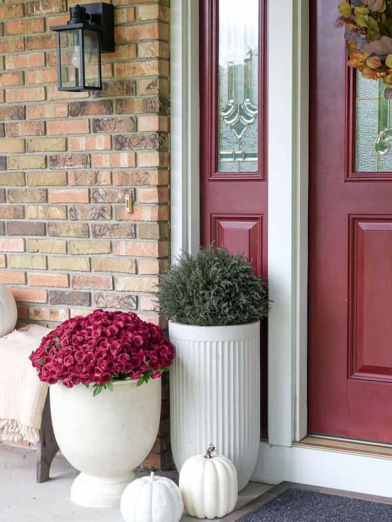 Cedar topiaries and faux mums.