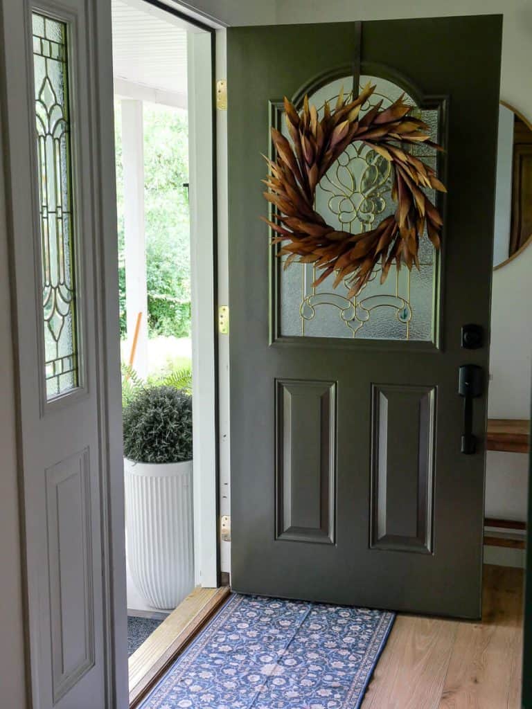 Front door with a fall wreath.