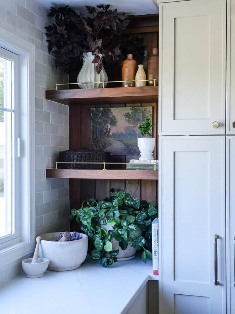 Close up of kitchen shelves with fall decor.