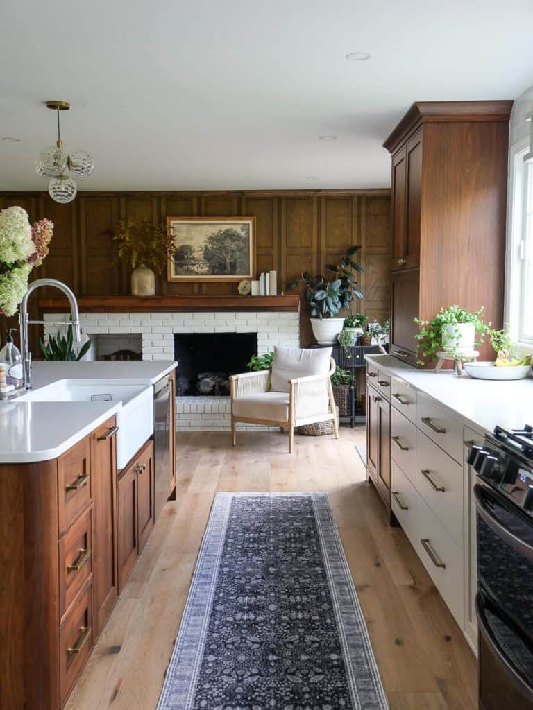 Kitchen with walnut paneling.