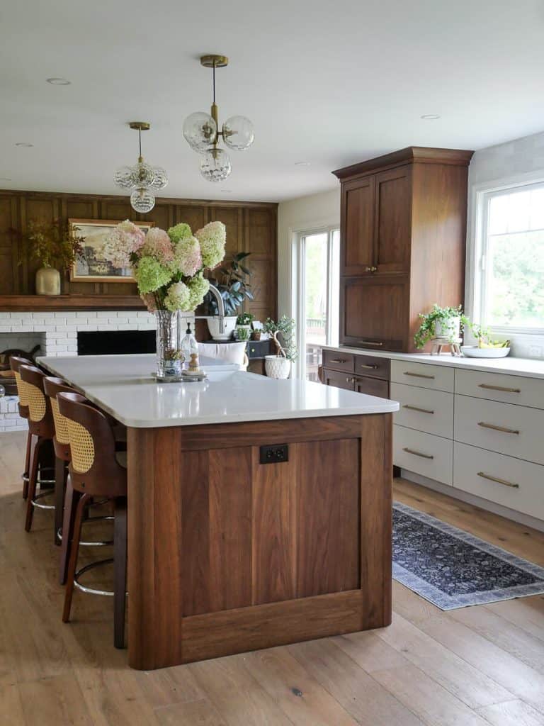 Kitchen with walnut island and washable area rug runner.