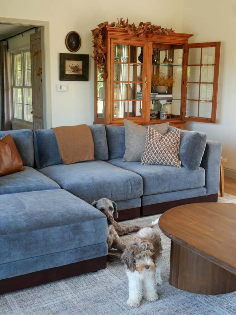Style your home for fall with leaf garland on hutch and fall pillows.