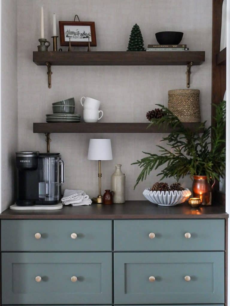 Coffee bar with a lamp and candle.