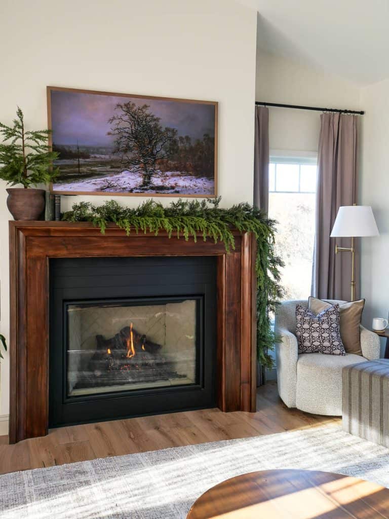Cozy winter decor with garlands on a mantel.
