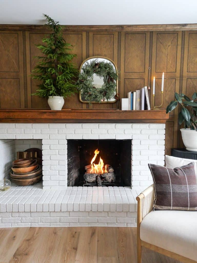 Fireplace styled for winter decor.