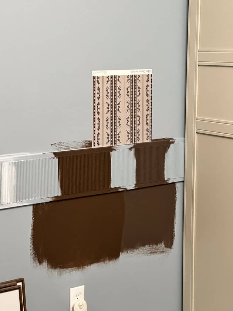 Two paint samples on the wall in different colors.