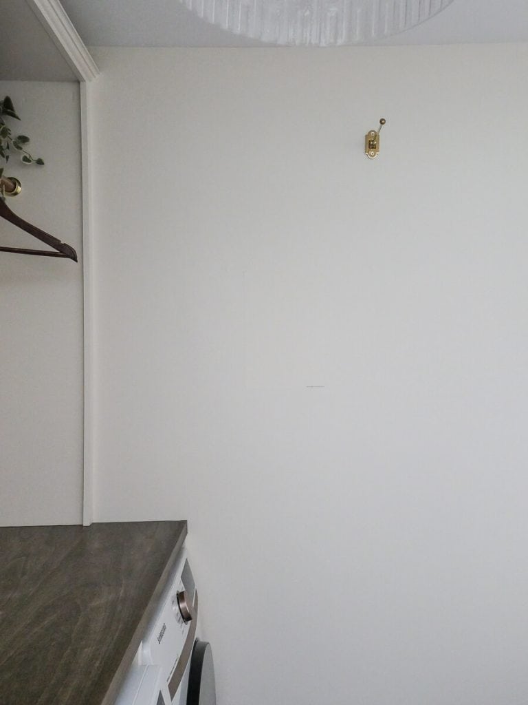 Up close look at a paint sample on a creamy wall.