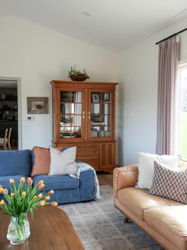 Living room with tulips on the coffee table.