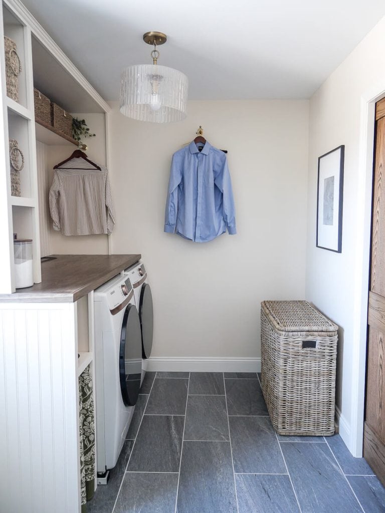 Laundry room with large Amazon find hamper.