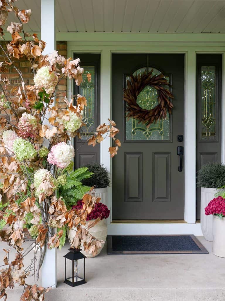 Dried hydrangeas in a fall front porch display.