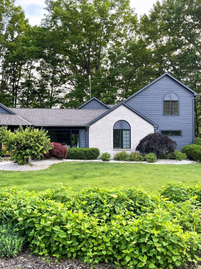 Large house with a landscaped yard.