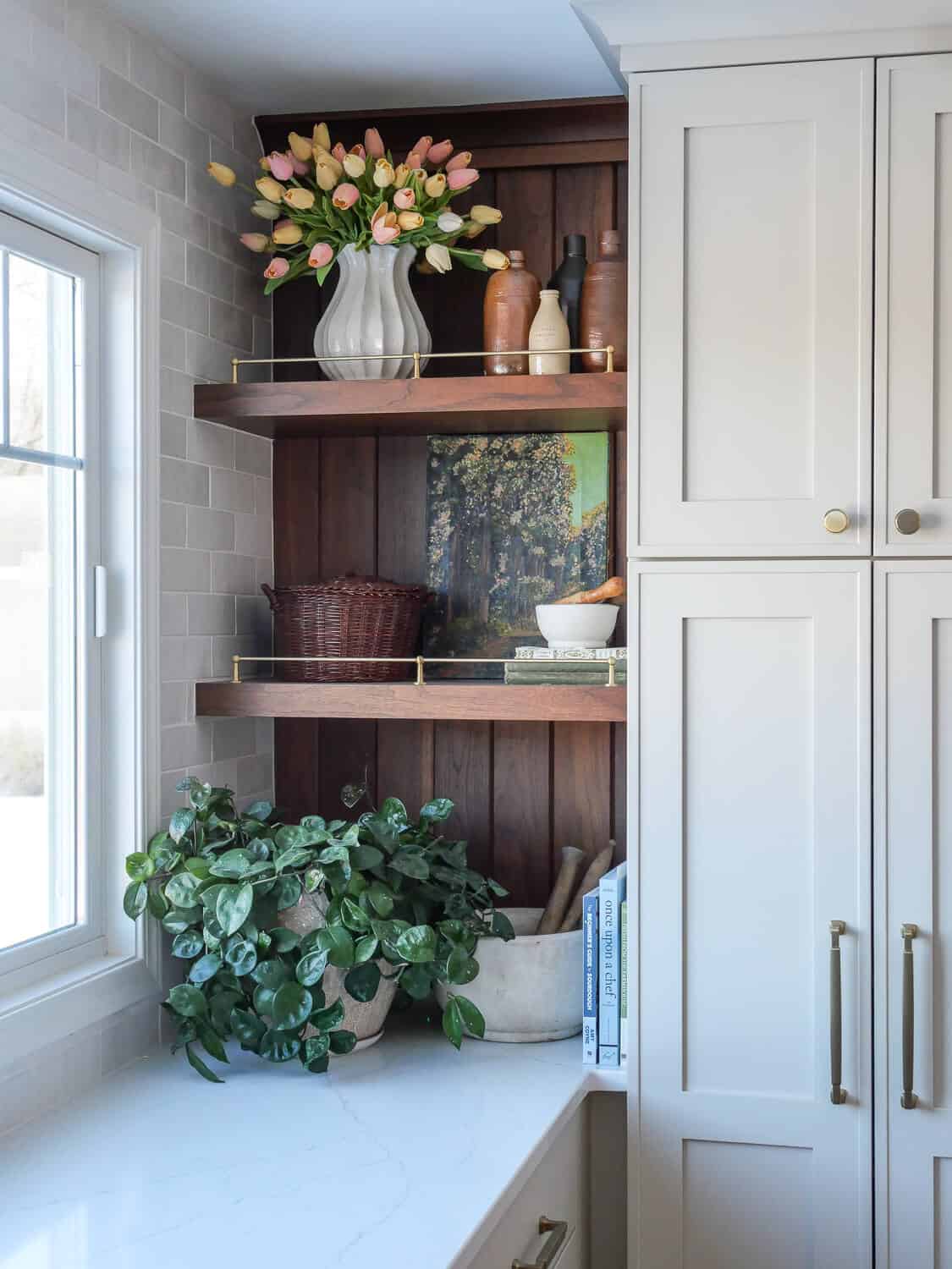 Spring artwork on open shelving in the kitchen.