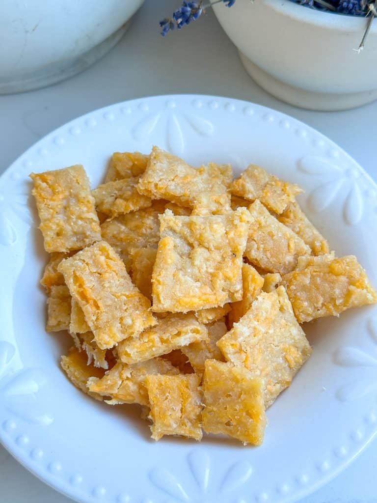 Cheese crackers in a bowl on the counter.