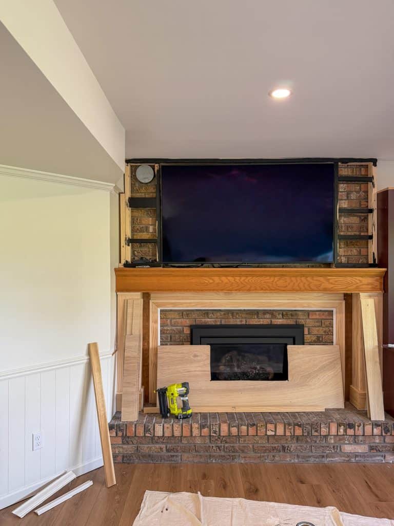 Framing over a brick fireplace.