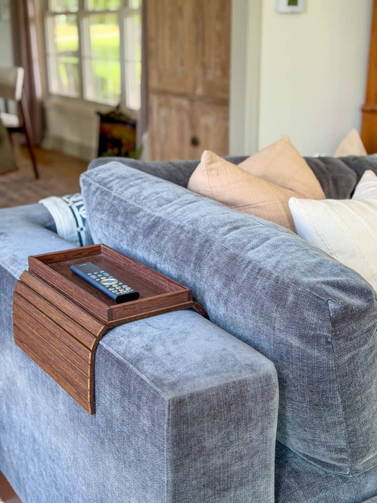 Sofa arm tray in a living room.