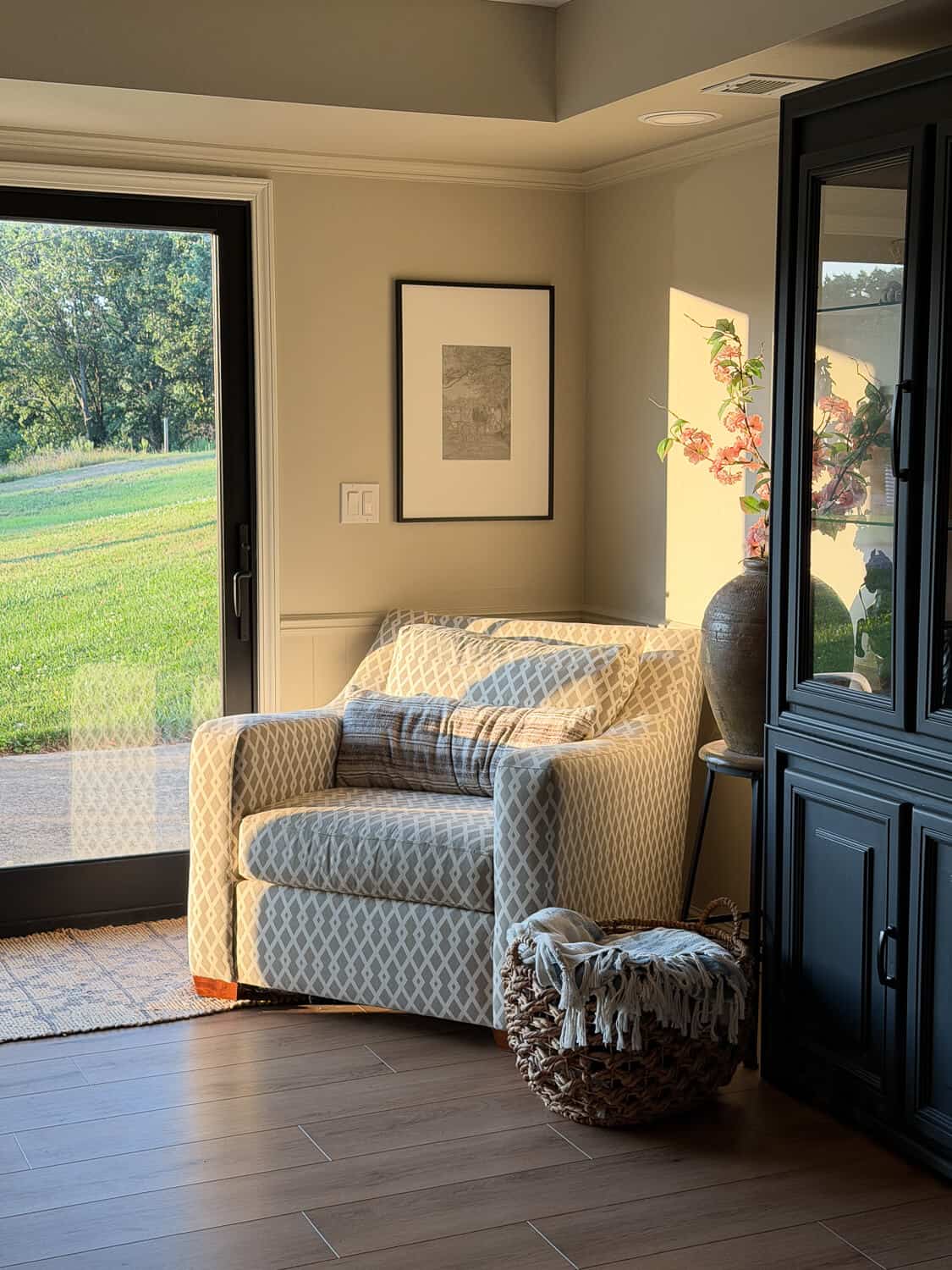 Oversized chair cast in soft light.