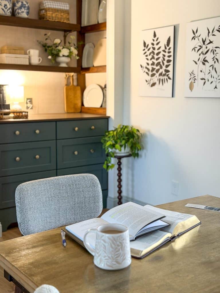 Open books on a dining table.