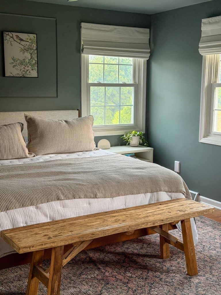 Organic bedding in a green bedroom.