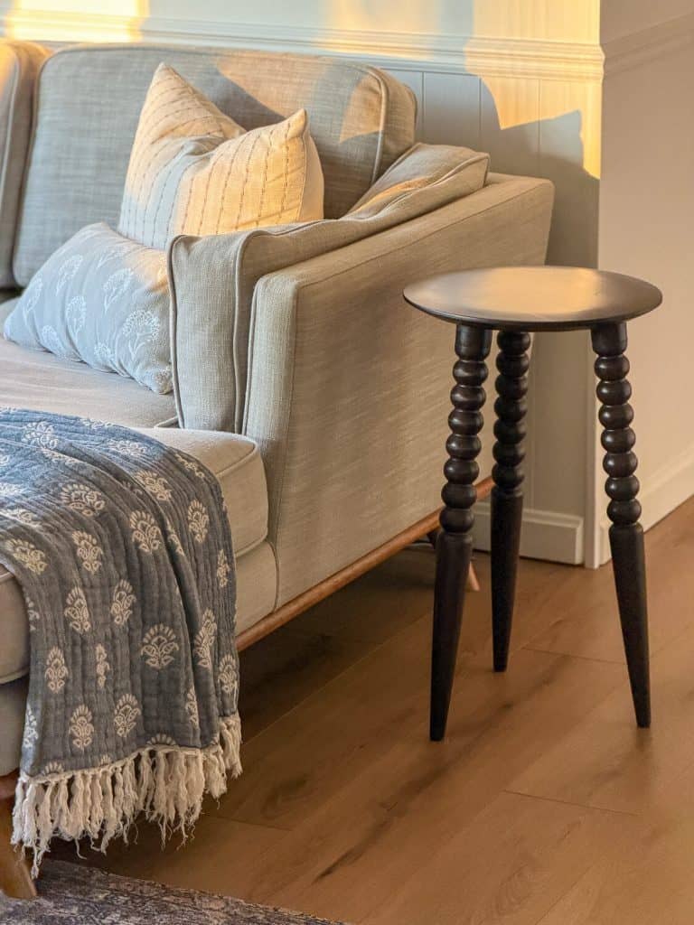 Sofa with small side table.